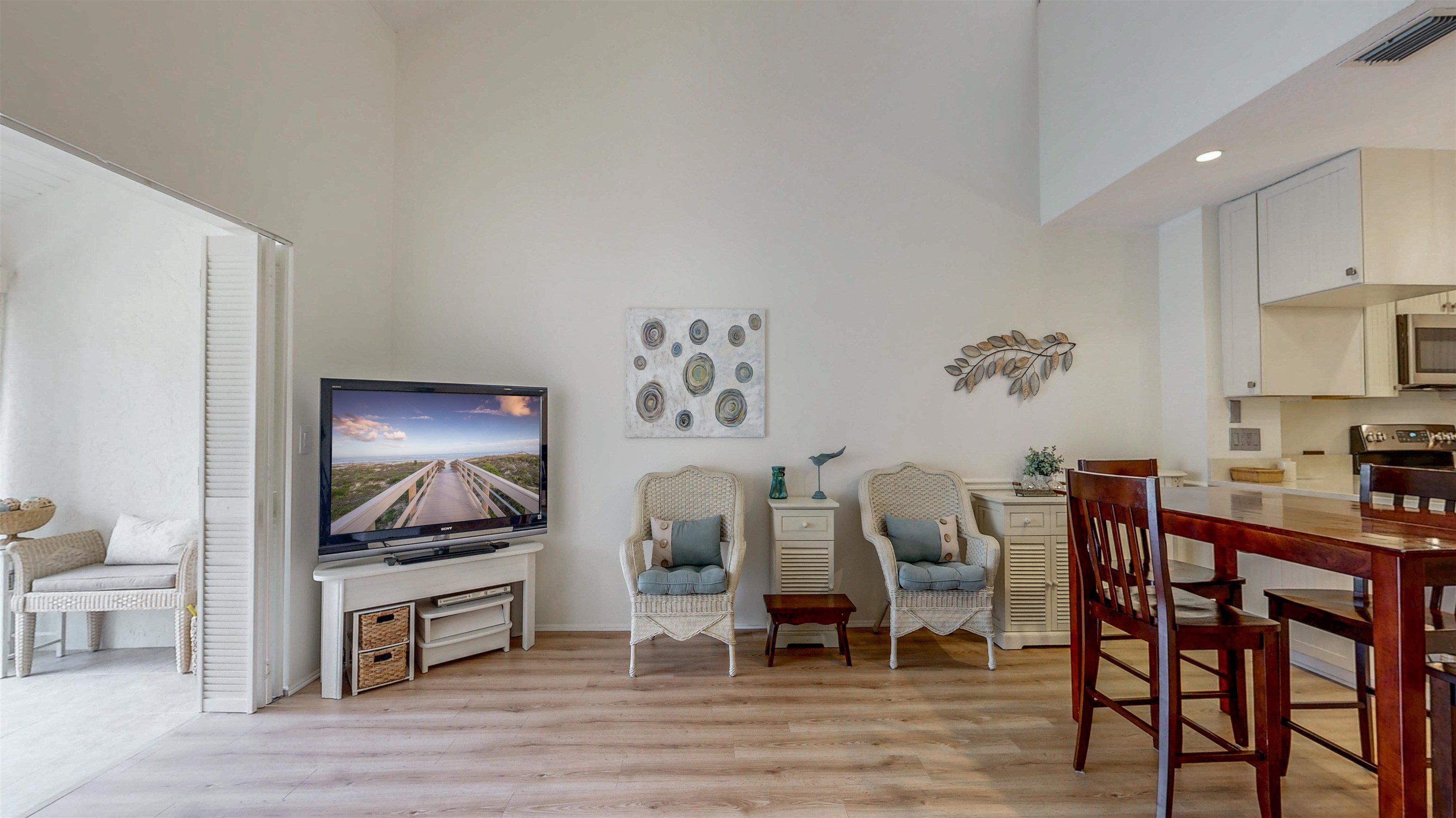 82 Village Las Palmas Circle St. Augustine, FL 32080 - Photo 22 of 58 Living room featuring light wood-type flooring, a high ceiling, and recessed lighting