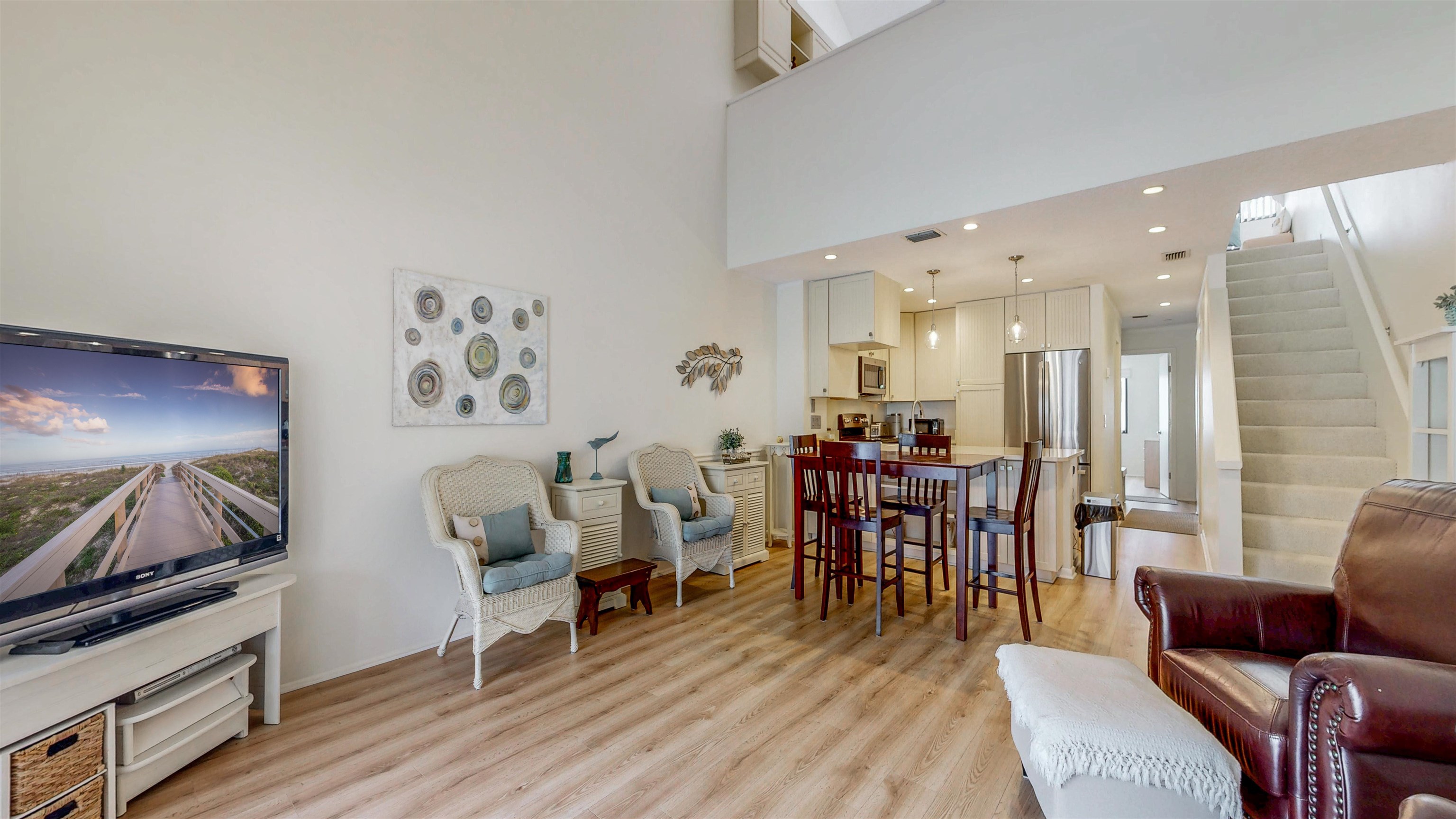 82 Village Las Palmas Circle St. Augustine, FL 32080 - Photo 23 of 58 Living room featuring light wood-style floors, recessed lighting, and a high ceiling