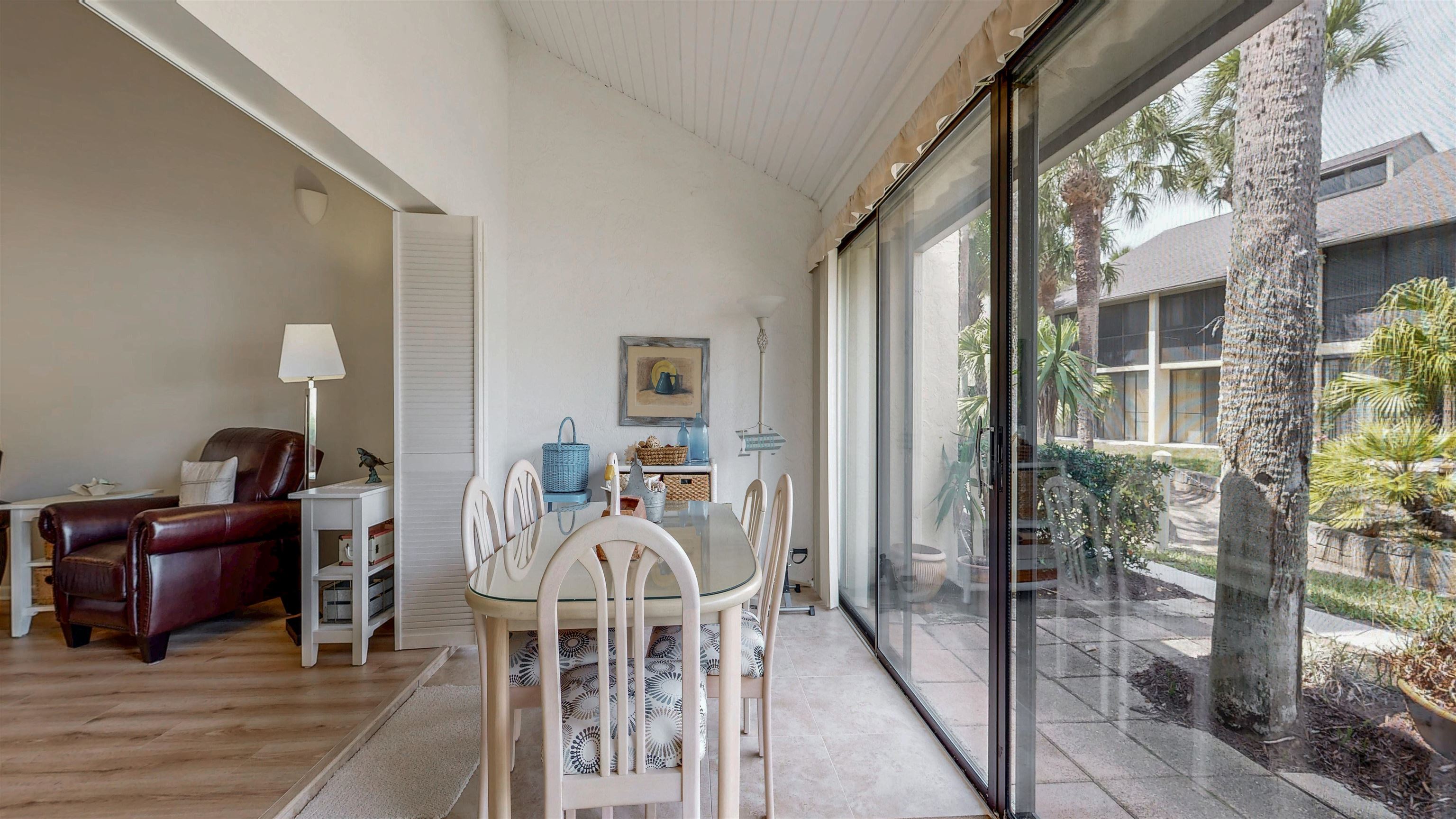 82 Village Las Palmas Circle St. Augustine, FL 32080 - Photo 25 of 58 Dining space featuring lofted ceiling and light wood finished floors