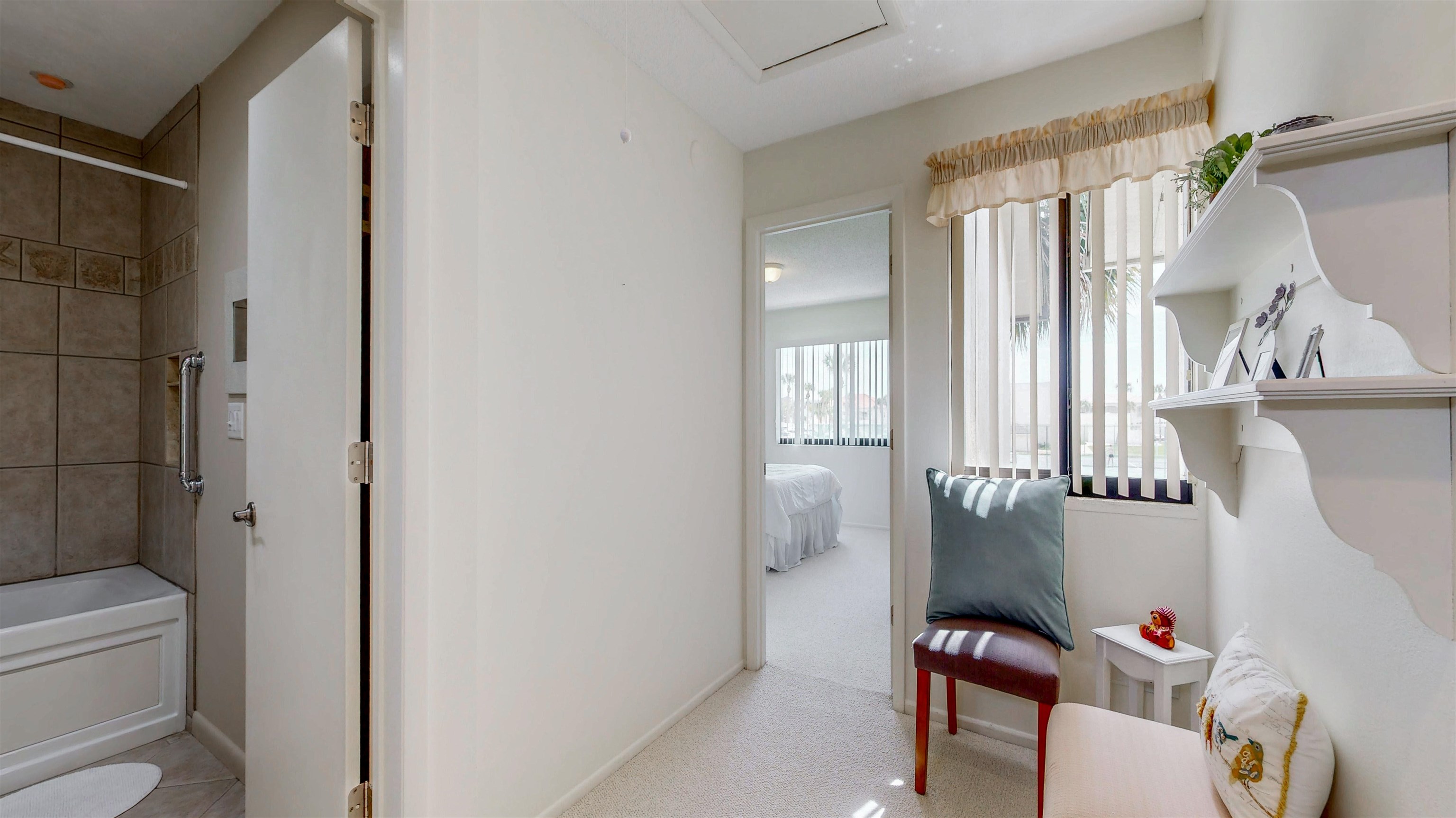 82 Village Las Palmas Circle St. Augustine, FL 32080 - Photo 27 of 58 Corridor with light carpet and baseboards
