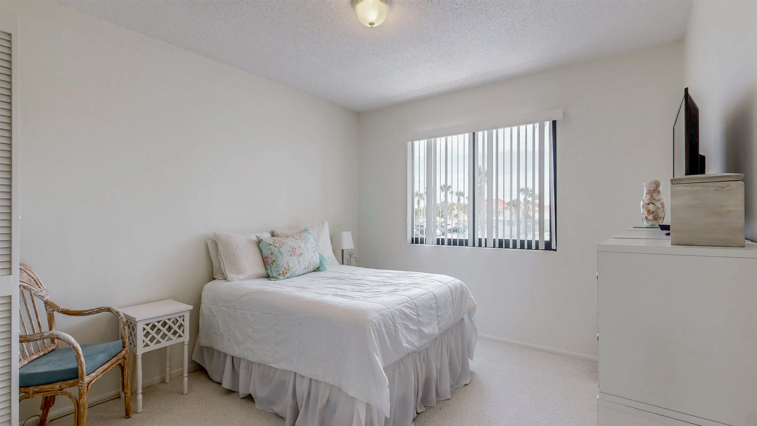 82 Village Las Palmas Circle St. Augustine, FL 32080 - Photo 28 of 58 Bedroom featuring a textured ceiling and light carpet