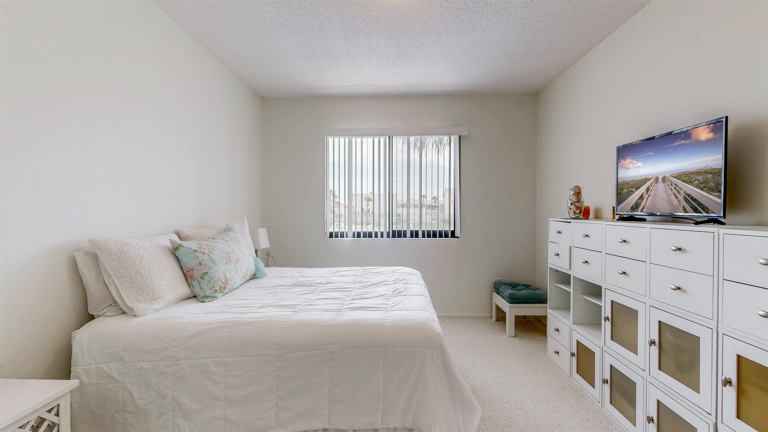 82 Village Las Palmas Circle St. Augustine, FL 32080 - Photo 29 of 58 Bedroom featuring a textured ceiling and light carpet