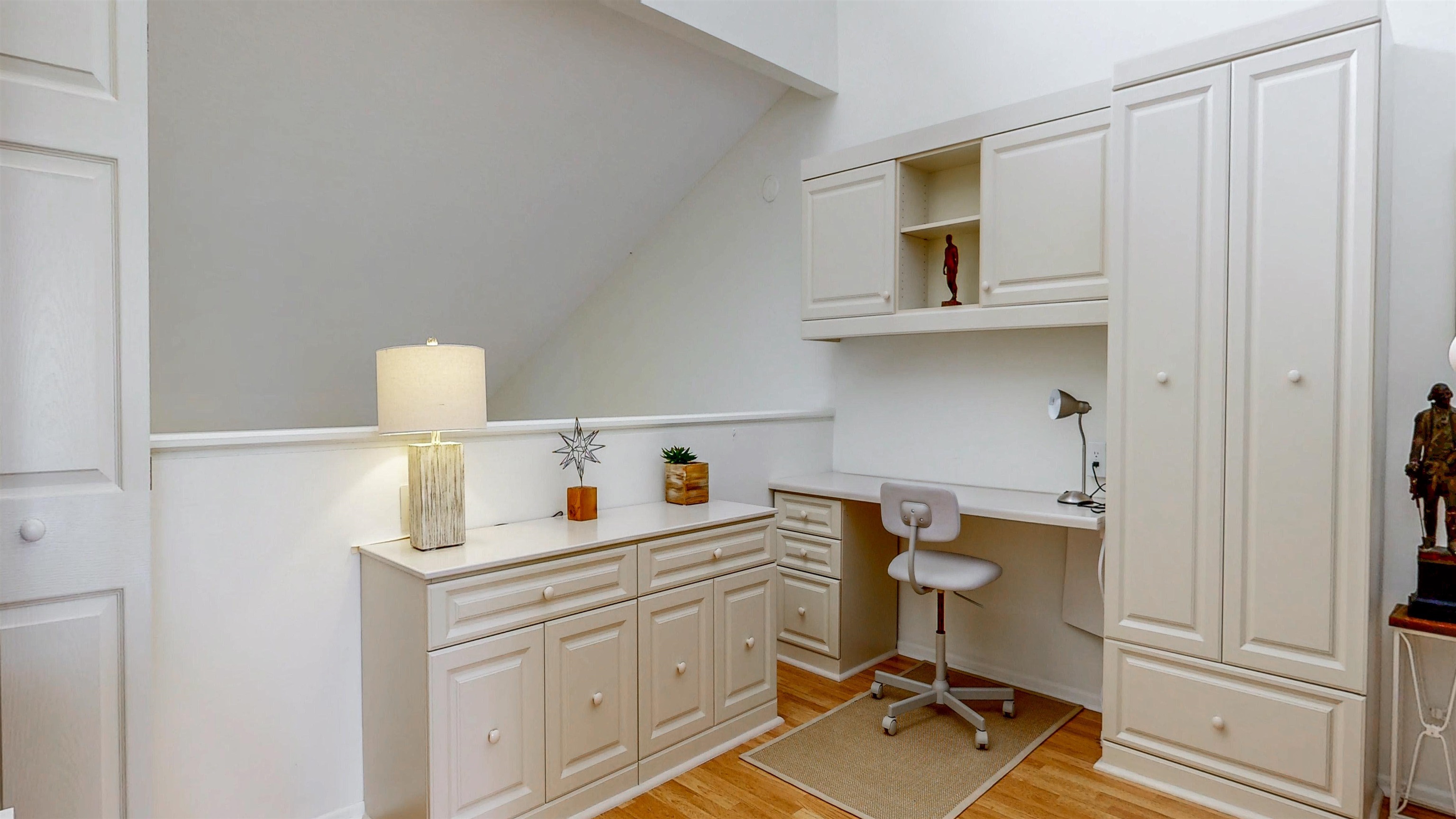 82 Village Las Palmas Circle St. Augustine, FL 32080 - Photo 40 of 58 Office area with built in desk, light wood-style floors, and lofted ceiling