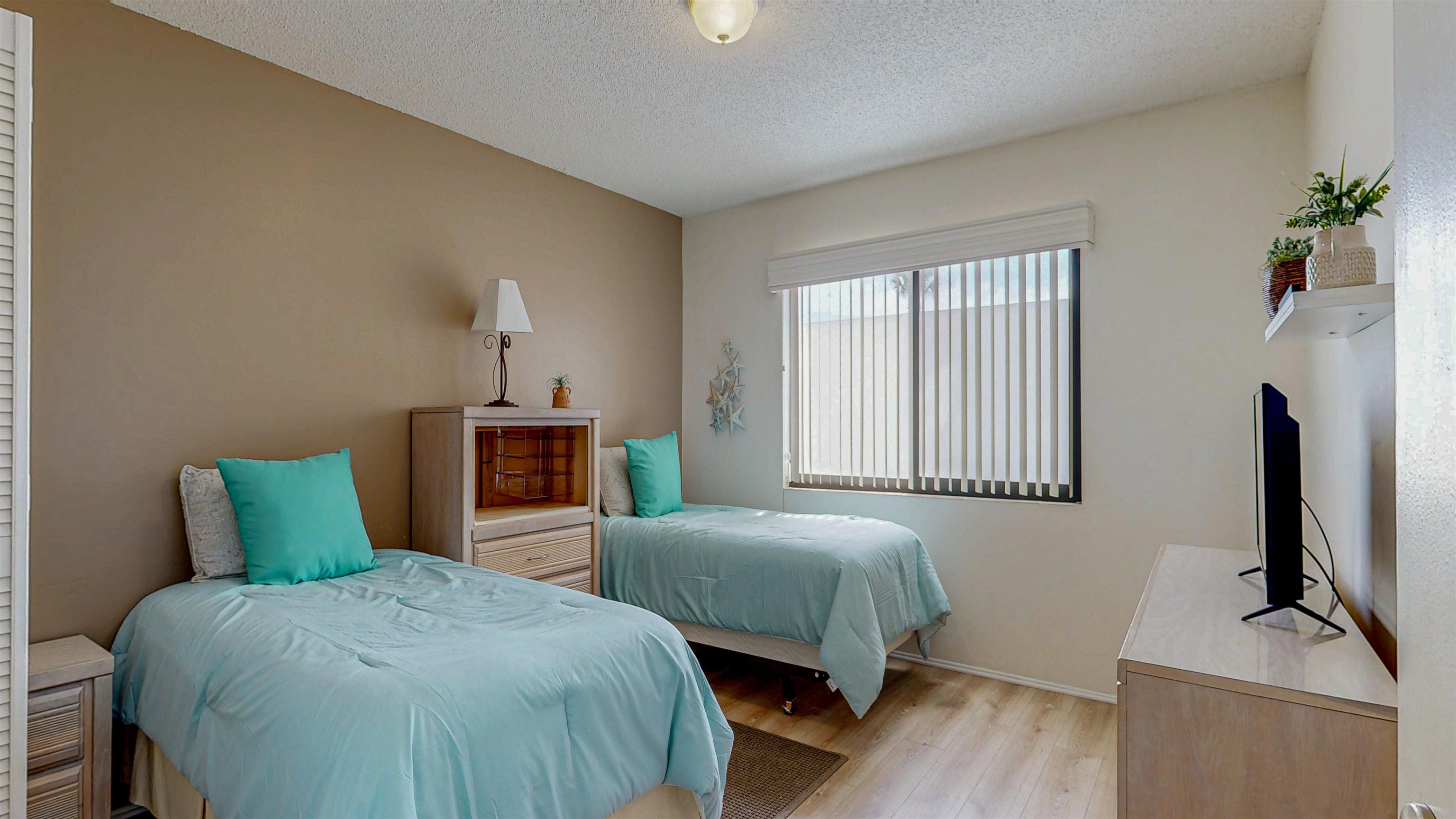 82 Village Las Palmas Circle St. Augustine, FL 32080 - Photo 47 of 58 Bedroom featuring light wood finished floors and a textured ceiling