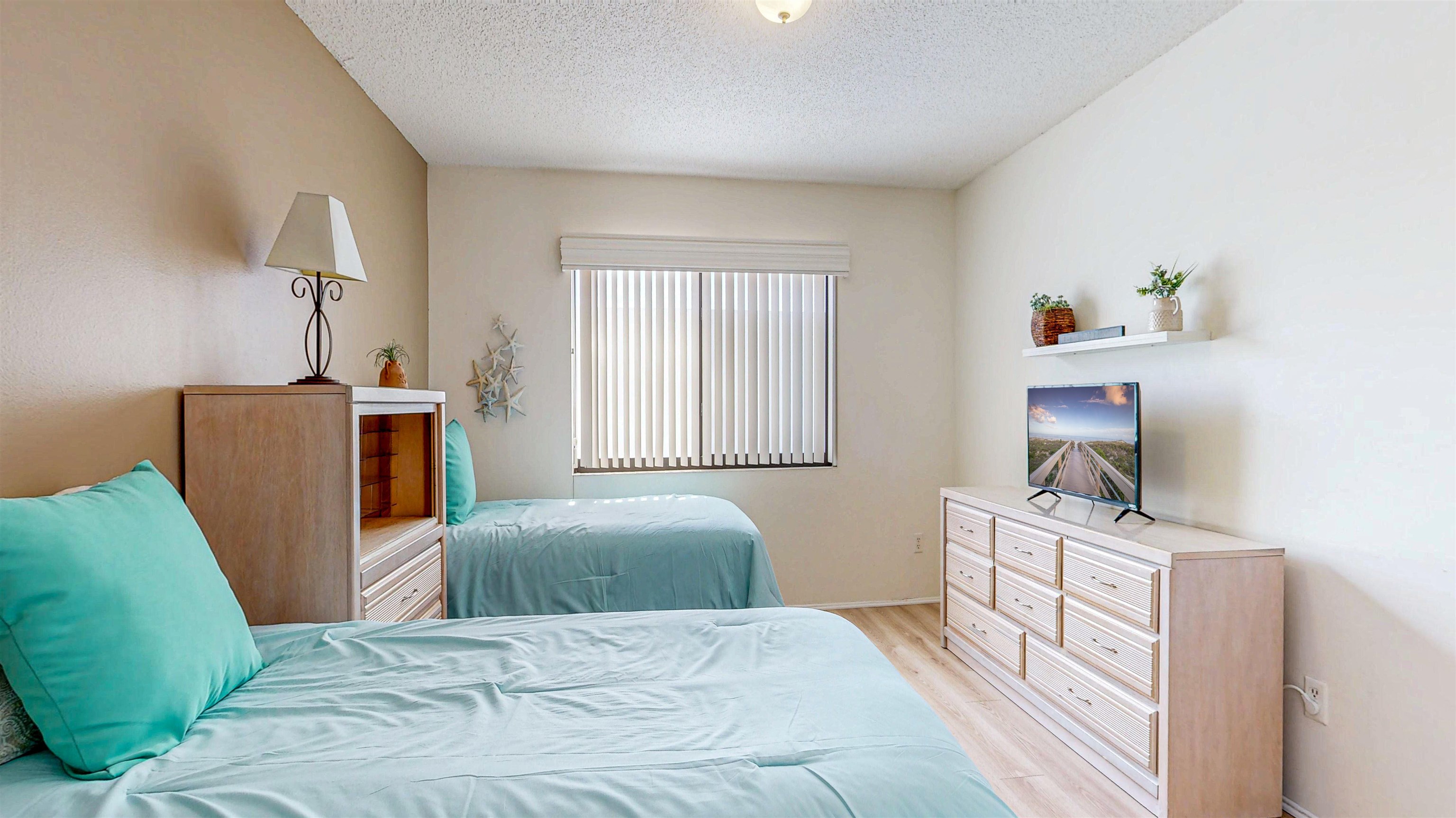82 Village Las Palmas Circle St. Augustine, FL 32080 - Photo 54 of 58 Bedroom featuring light wood-style floors and a textured ceiling
