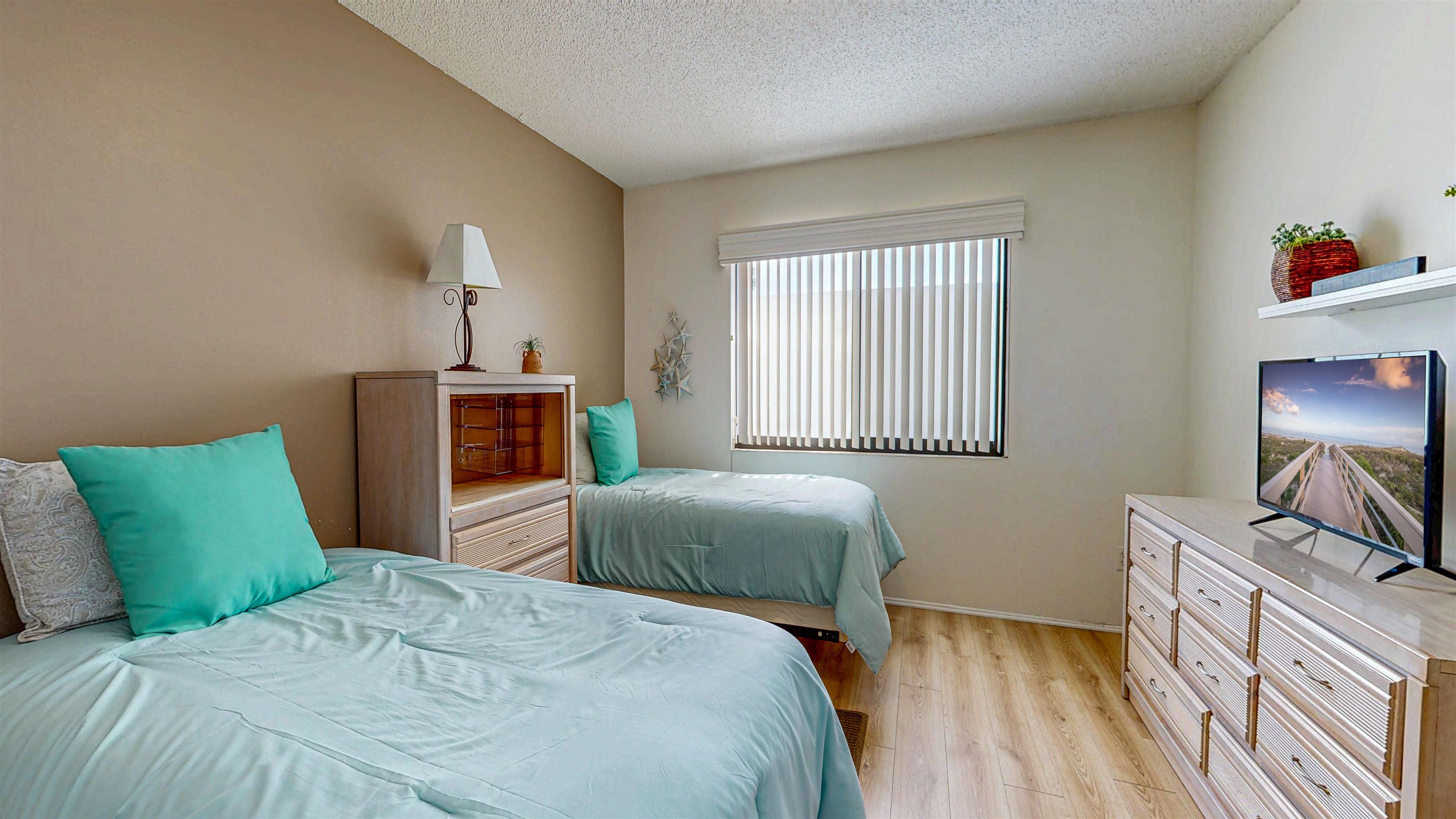 82 Village Las Palmas Circle St. Augustine, FL 32080 - Photo 55 of 58 Bedroom featuring light wood finished floors and a textured ceiling