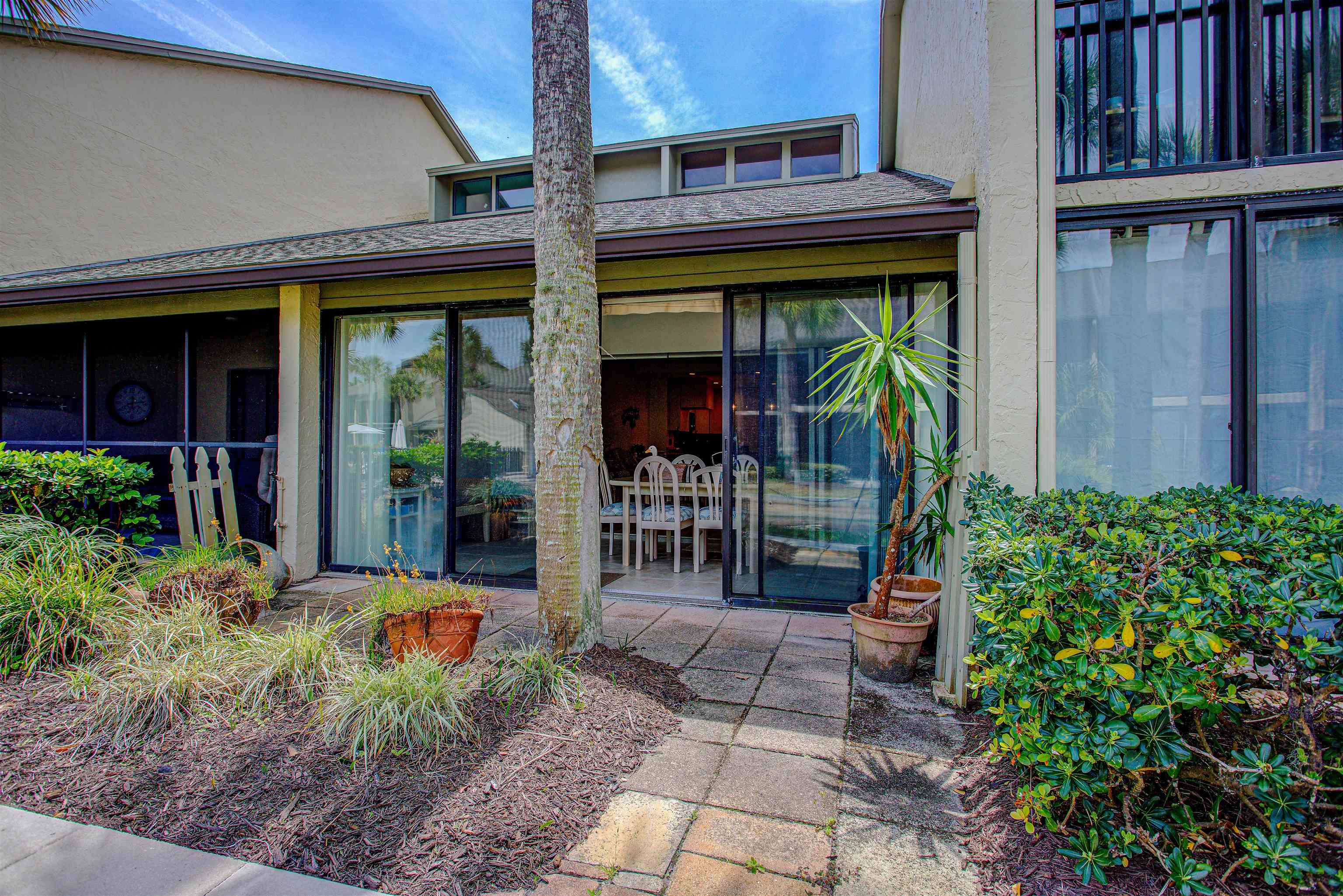 82 Village Las Palmas Circle St. Augustine, FL 32080 - Photo 9 of 58 Entrance to property featuring roof with shingles and stucco siding