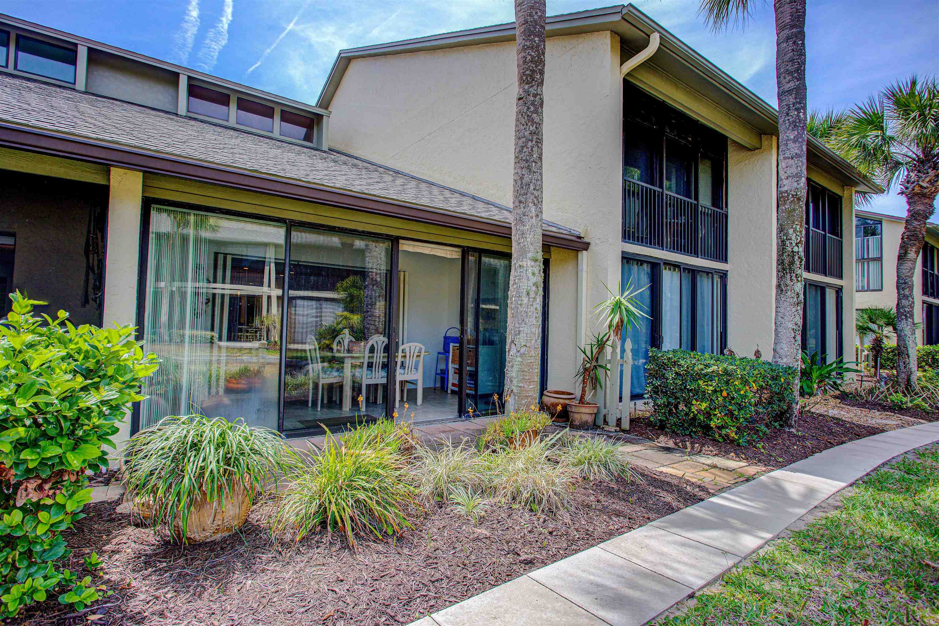 82 Village Las Palmas Circle St. Augustine, FL 32080 - Photo 10 of 58 View of exterior entry featuring stucco siding