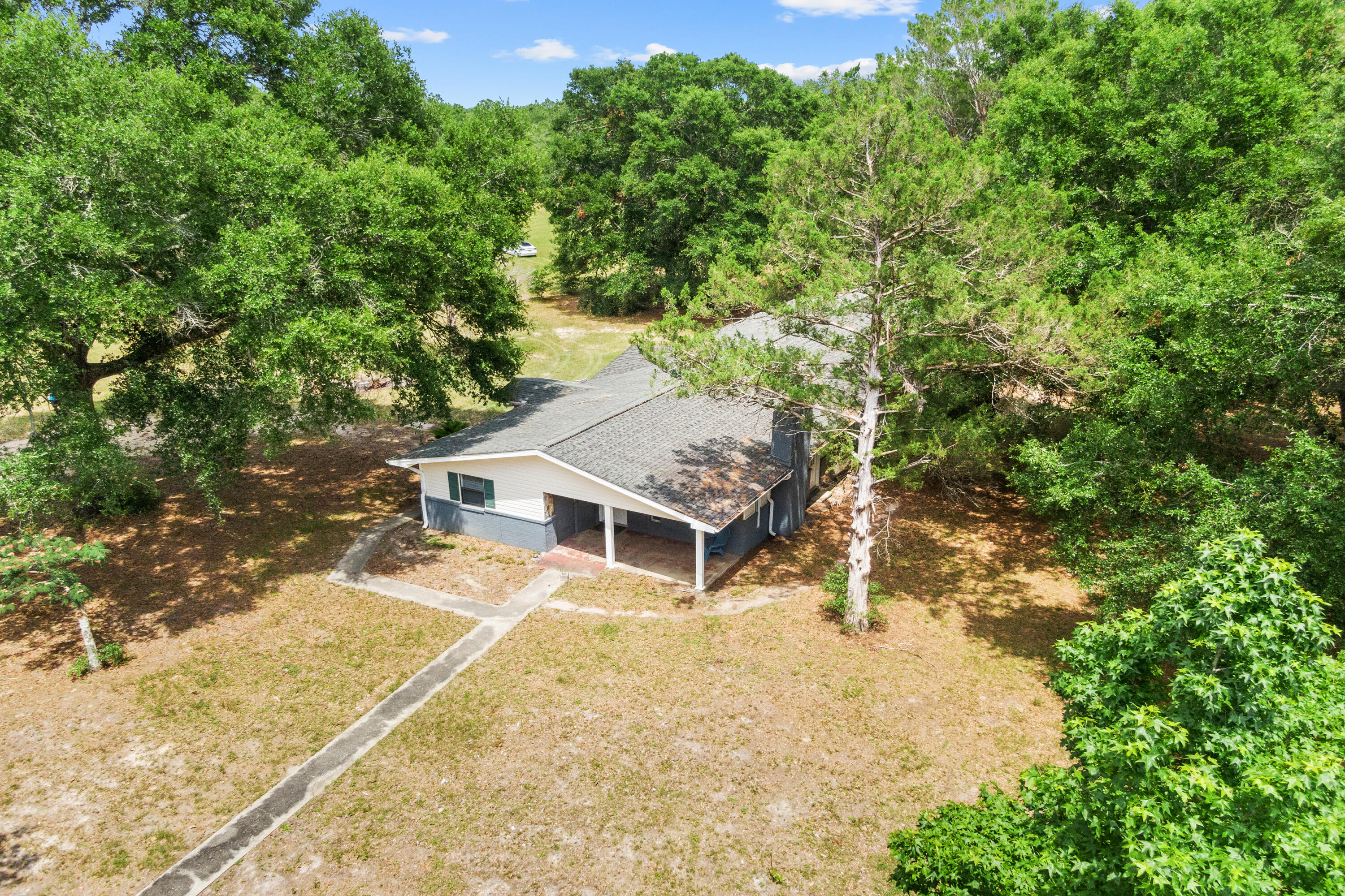 540 John King Road Crestview, FL 32539 - Photo 16 of 59 a house with trees in front of it