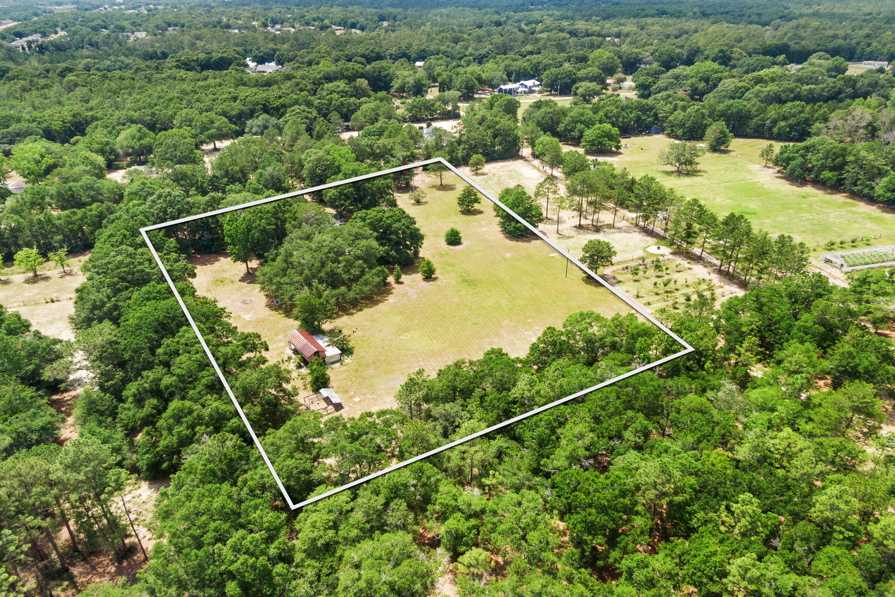 540 John King Road Crestview, FL 32539 - Photo 18 of 59 an aerial view of a residential houses with outdoor space and trees