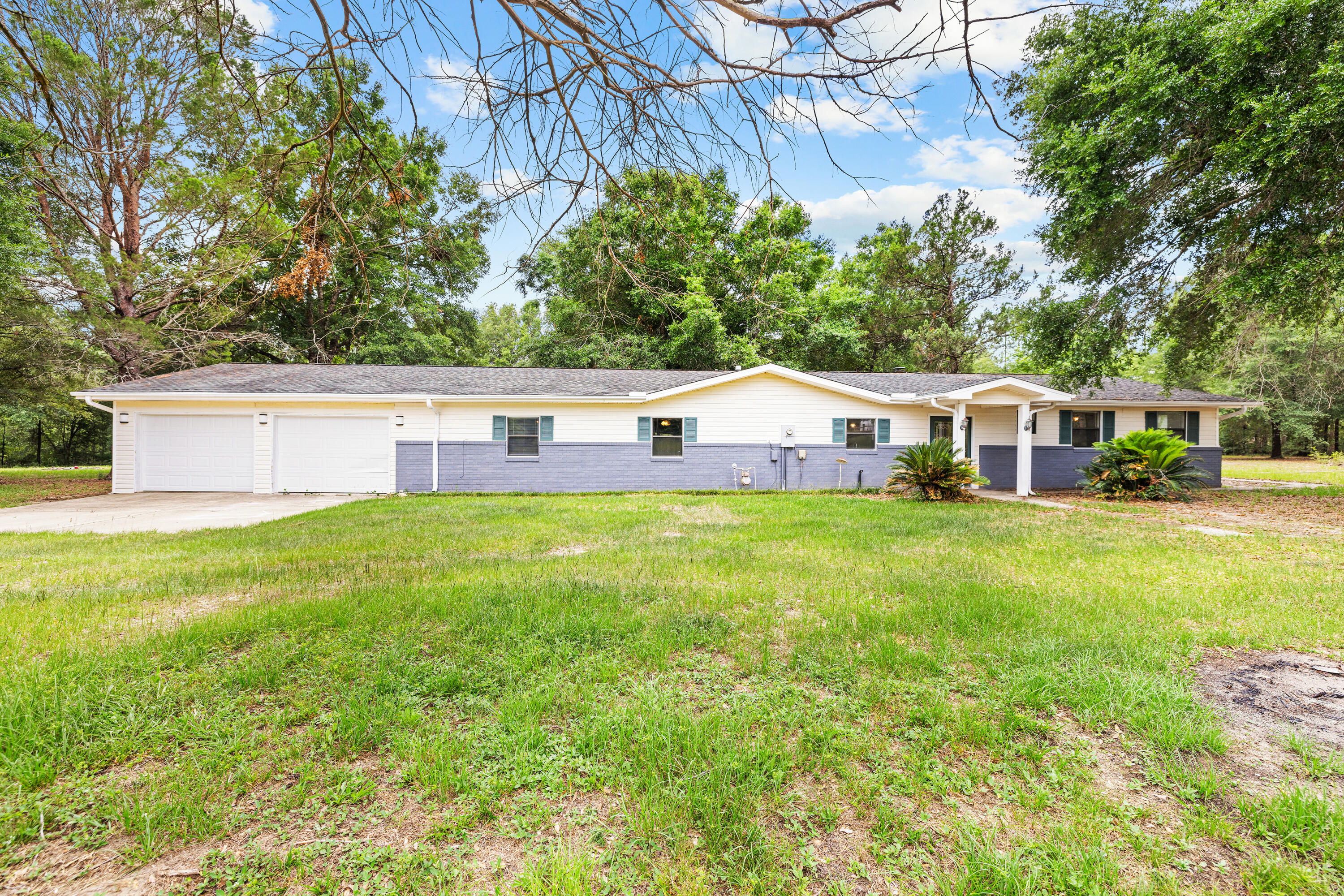 540 John King Road Crestview, FL 32539 - Photo 2 of 59 a front view of house with yard and seating area