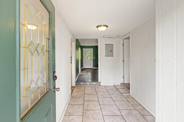 a living room with fireplace and a fireplace