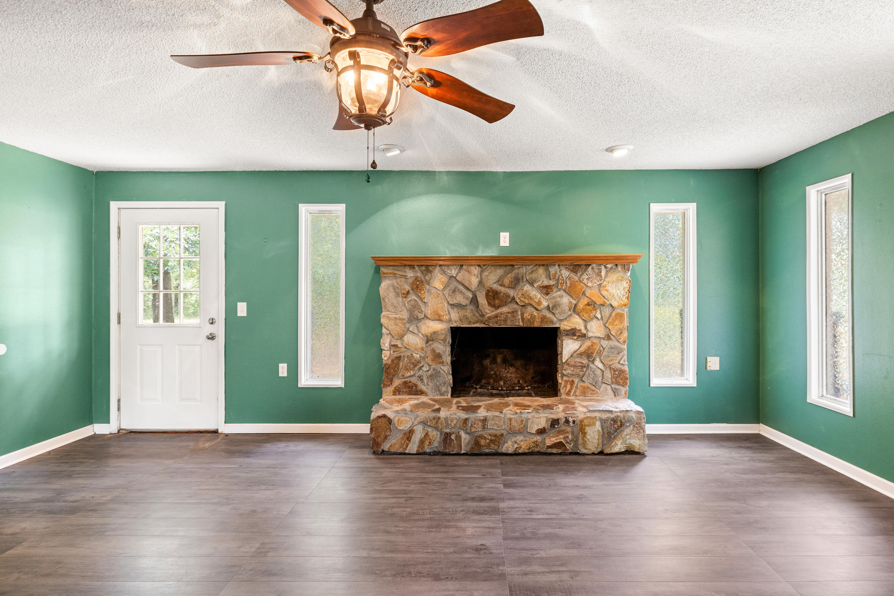540 John King Road Crestview, FL 32539 - Photo 24 of 59 a living room with fireplace and a fireplace