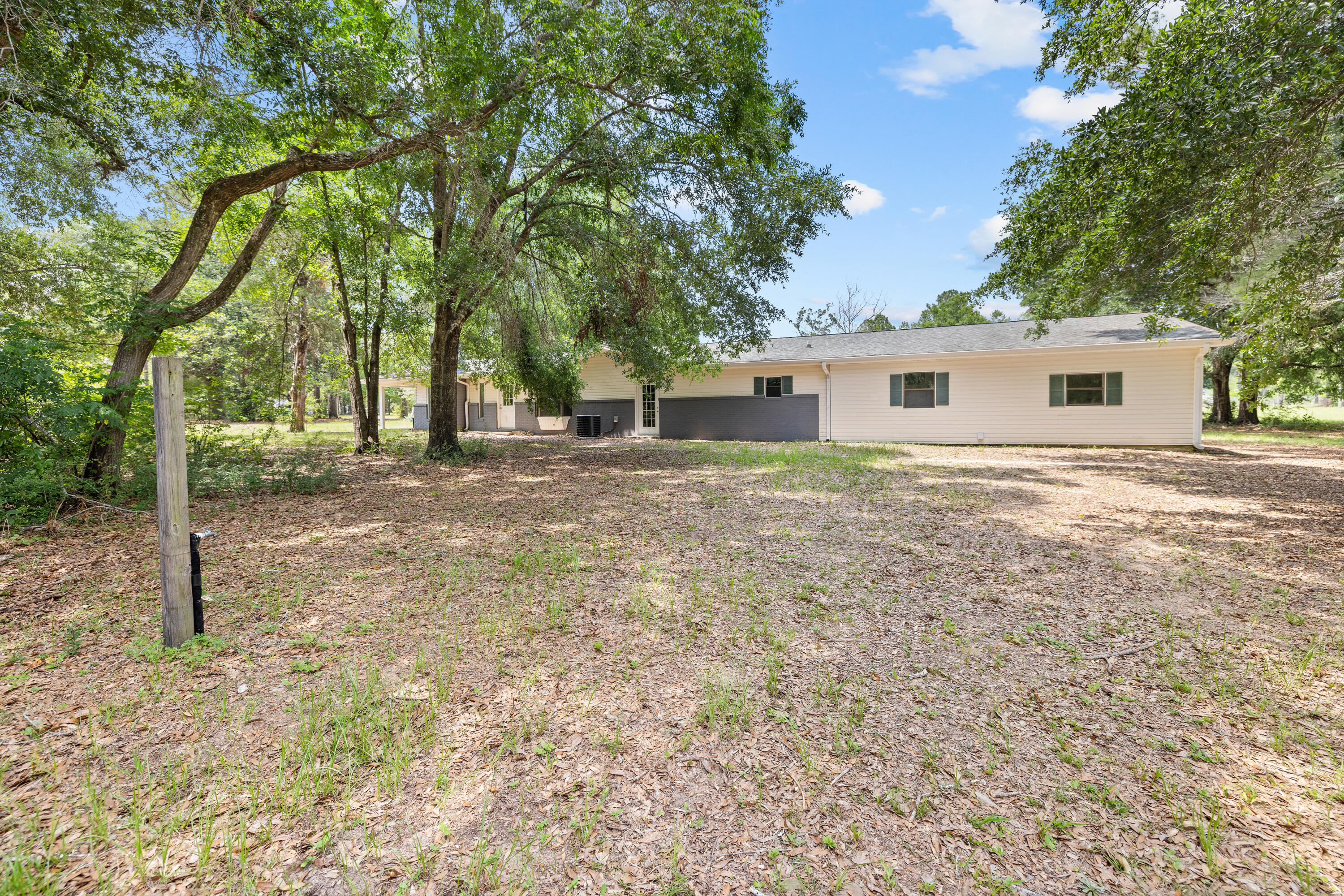 540 John King Road Crestview, FL 32539 - Photo 9 of 59 a house with trees in front of it