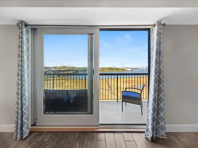 a view of two chairs in the balcony