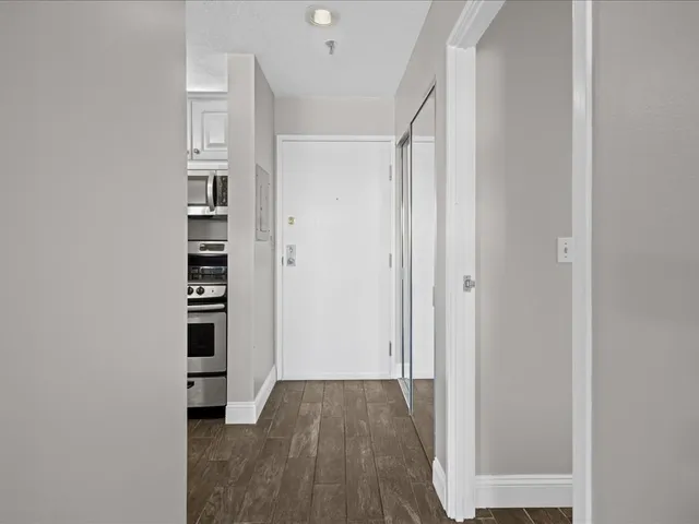 a workspace with furniture and wooden floor