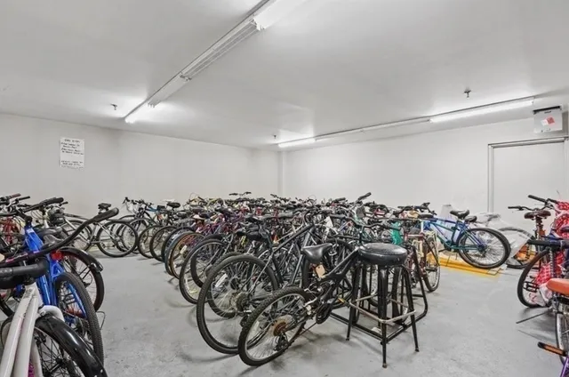 a front view of a building with a yard and pathway