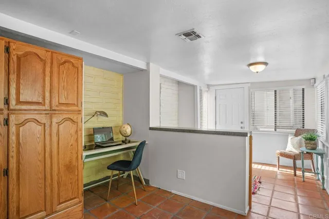a kitchen with a sink cabinets and appliances