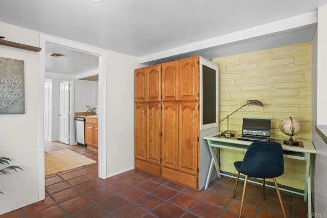 a spacious bathroom with a granite countertop sink a mirror and a