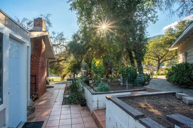 a lobby with furniture and potted plants