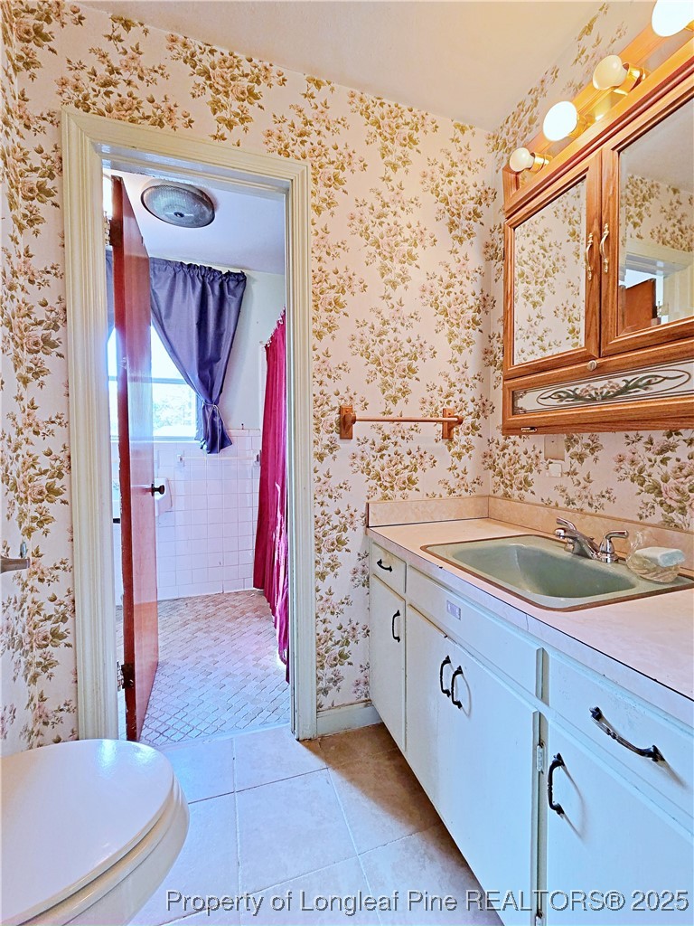 764 Old Vander Road Fayetteville, NC 28312 - Photo 19 of 50 a bathroom with a sink and a mirror