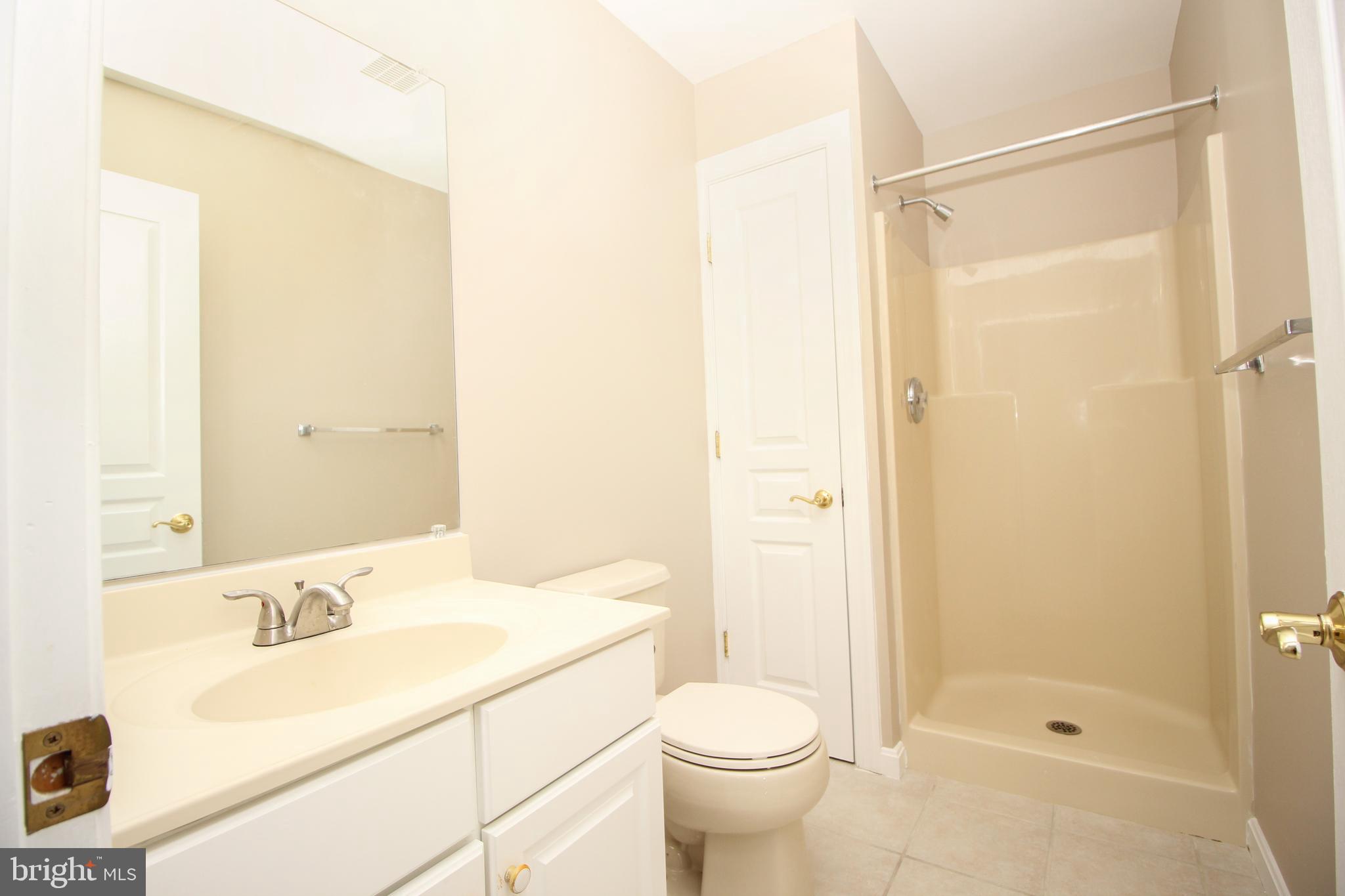 801 Taylor Street Riverside, NJ 08075 - Photo 14 of 34 a bathroom with a granite countertop sink toilet and shower