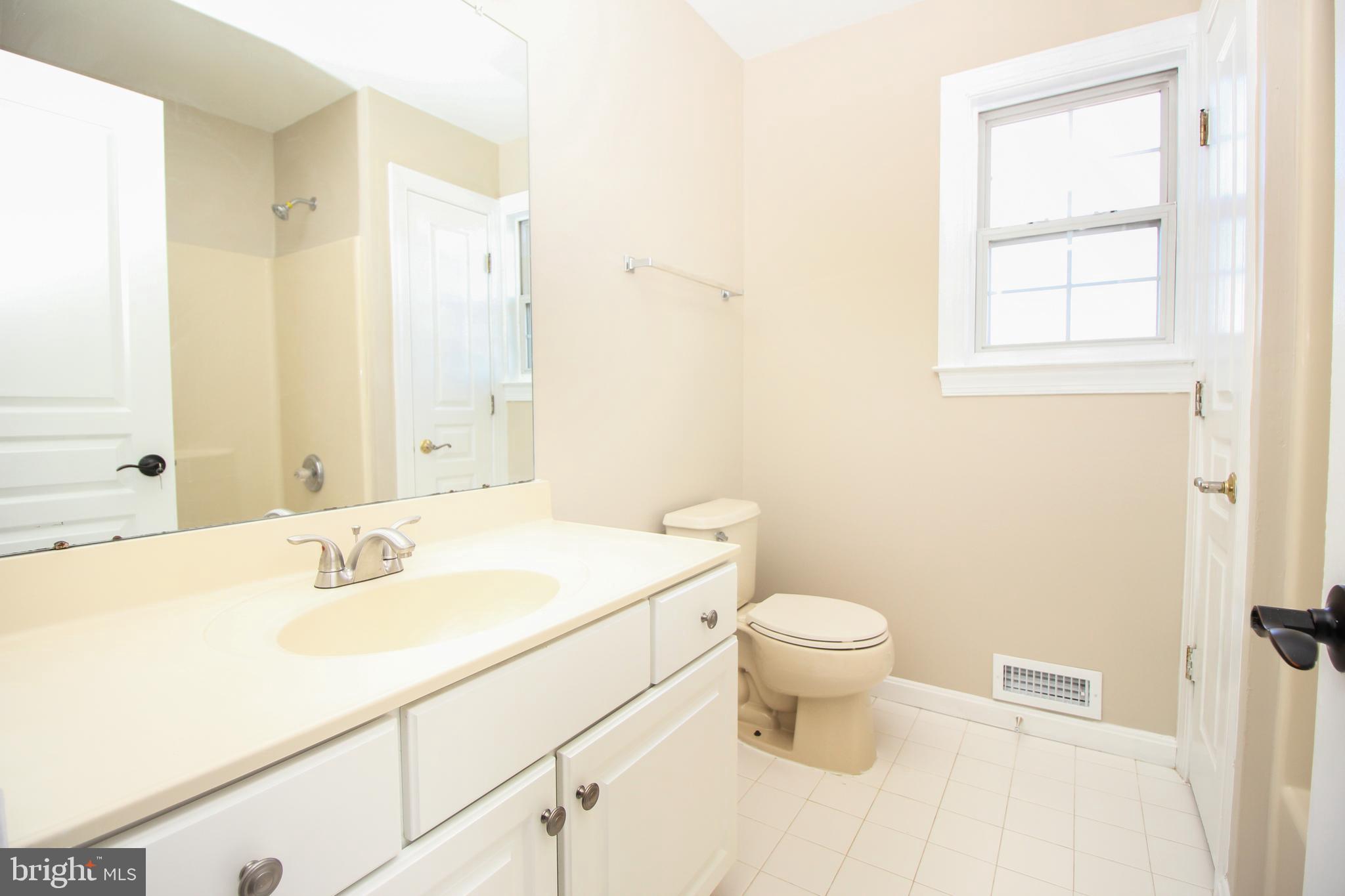801 Taylor Street Riverside, NJ 08075 - Photo 19 of 34 a bathroom with a sink toilet and a mirror