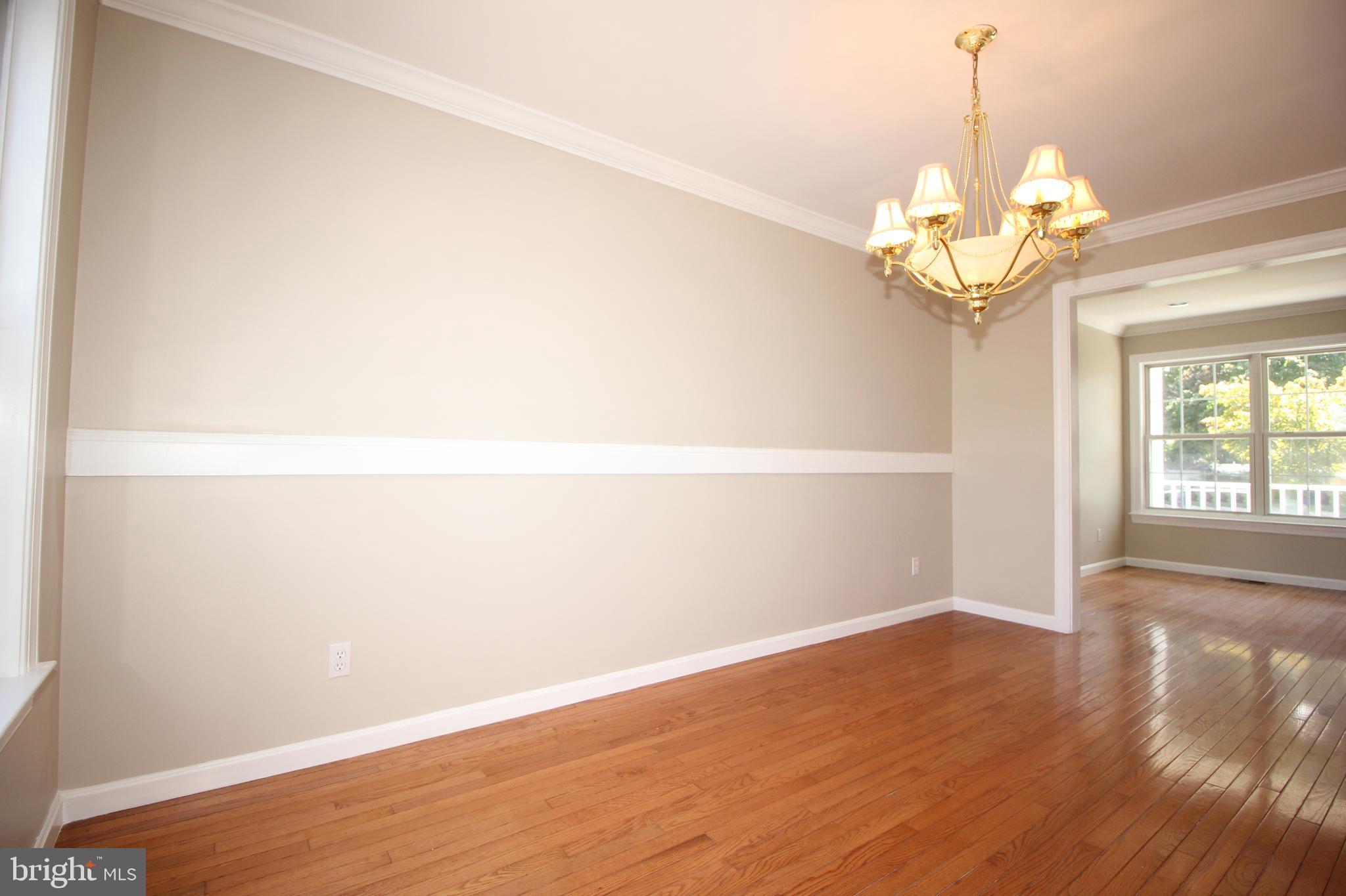 801 Taylor Street Riverside, NJ 08075 - Photo 8 of 34 a view of a room with wooden floor and chandelier