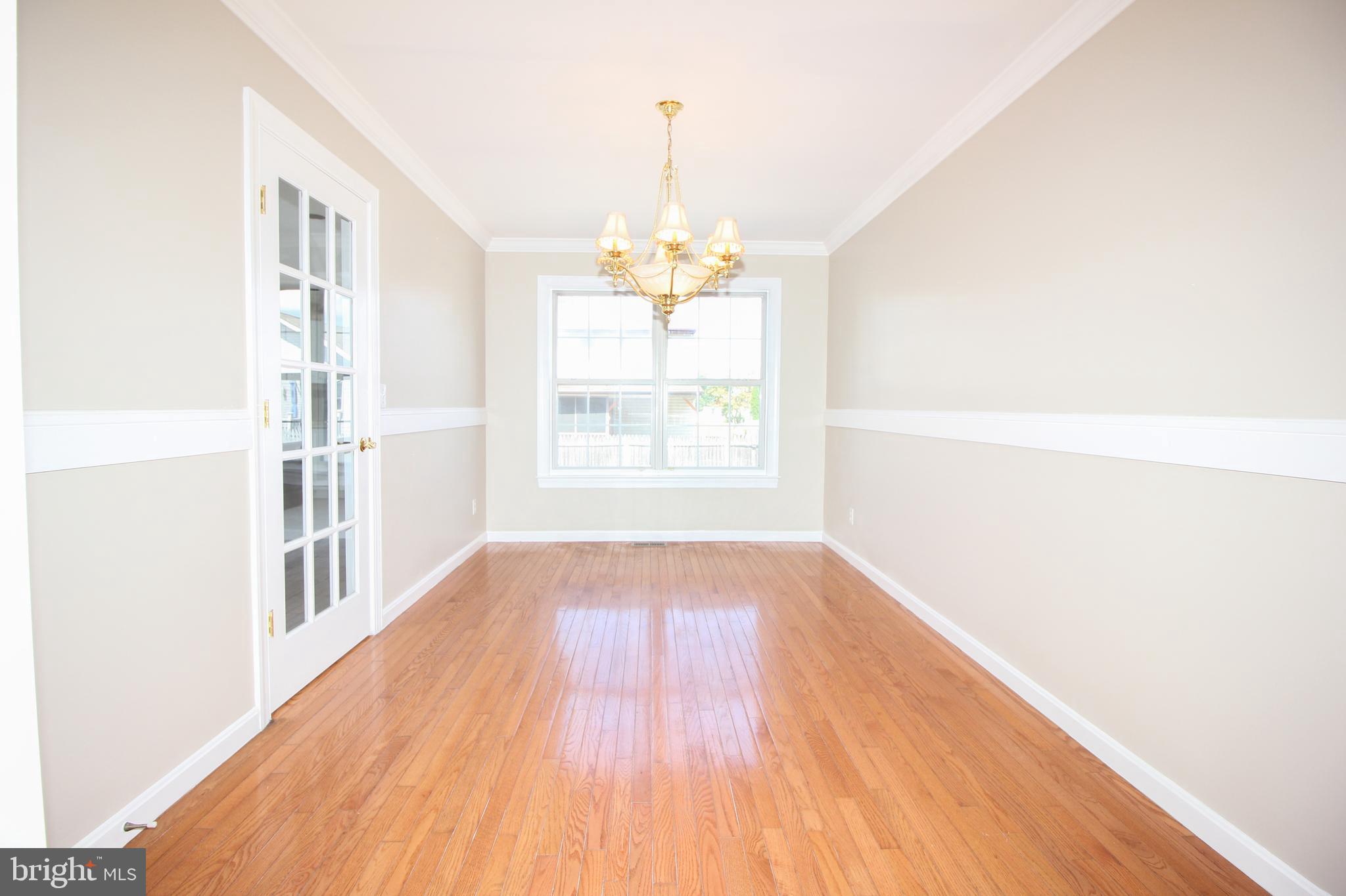 801 Taylor Street Riverside, NJ 08075 - Photo 9 of 34 a view of empty room with wooden floor and fan
