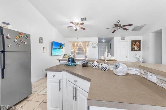 681-683 Alabama Road South, Unit 683 Lehigh Acres, FL 33974 - Photo 12 of 35 a kitchen with a sink refrigerator and chandelier