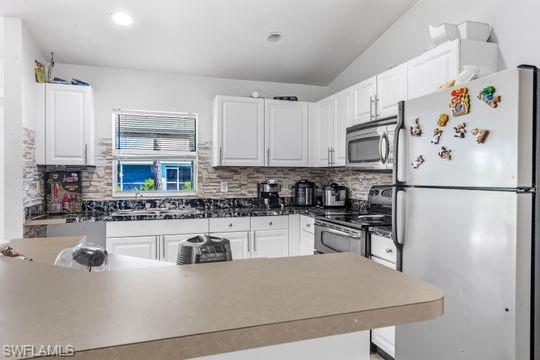 681-683 Alabama Road South, Unit 683 Lehigh Acres, FL 33974 - Photo 13 of 35 a kitchen with stainless steel appliances granite countertop a sink stove and refrigerator