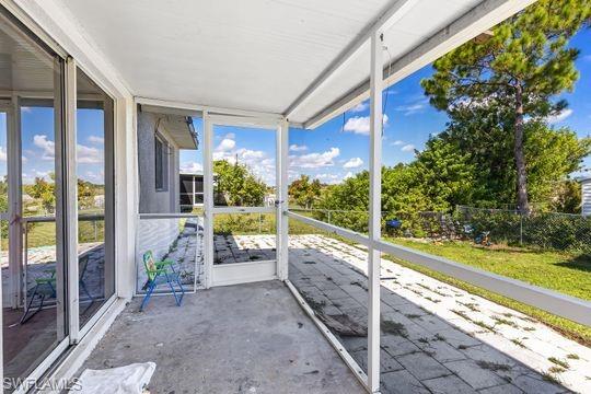 681-683 Alabama Road South, Unit 683 Lehigh Acres, FL 33974 - Photo 14 of 35 a view of a porch with furniture and garden