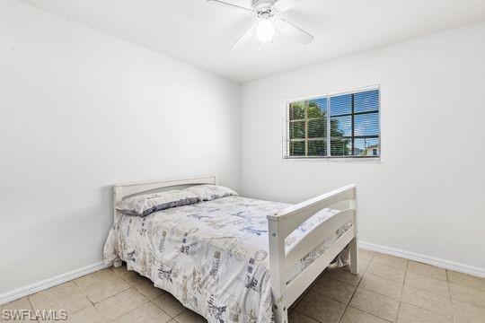 681-683 Alabama Road South, Unit 683 Lehigh Acres, FL 33974 - Photo 22 of 35 a bedroom with a bed and a window