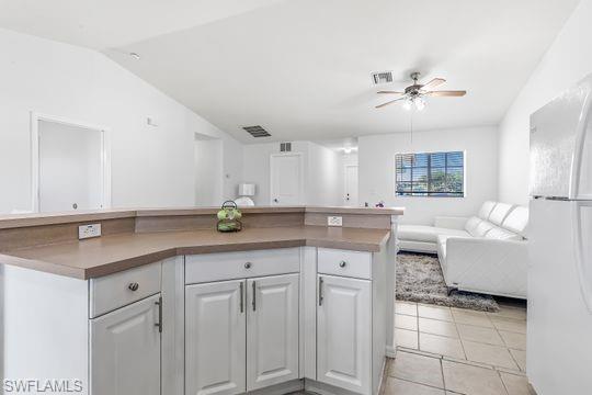 681-683 Alabama Road South, Unit 683 Lehigh Acres, FL 33974 - Photo 27 of 35 a kitchen with cabinets and window