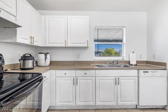 681-683 Alabama Road South, Unit 683 Lehigh Acres, FL 33974 - Photo 29 of 35 a kitchen with granite countertop white cabinets and appliances
