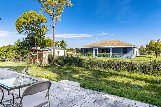 681-683 Alabama Road South, Unit 683 Lehigh Acres, FL 33974 - Photo 32 of 35 a view of a house with a yard