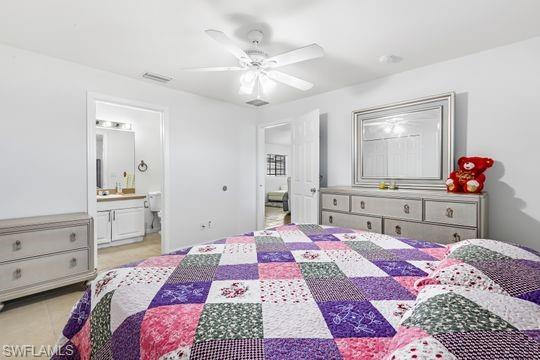 681-683 Alabama Road South, Unit 683 Lehigh Acres, FL 33974 - Photo 34 of 35 a bedroom with a bed and wooden floor