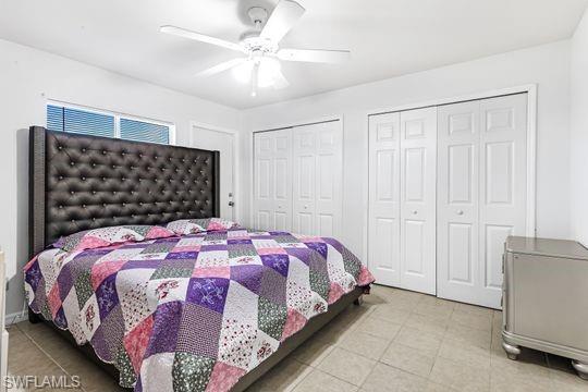 681-683 Alabama Road South, Unit 683 Lehigh Acres, FL 33974 - Photo 35 of 35 a bedroom with a bed and a chandelier