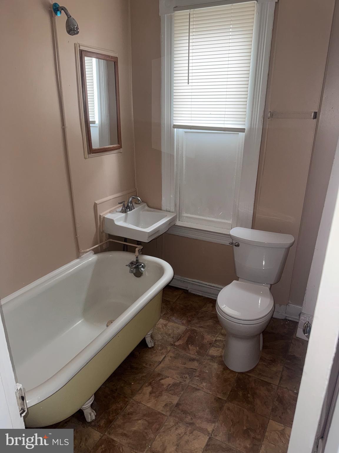 1812 North Payson Street Baltimore, MD 21217 - Photo 10 of 11 a bathroom with a sink toilet and shower