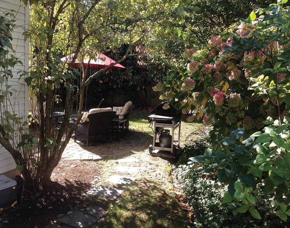 68 Bow Road Newton, MA 02459 - Photo 16 of 16 a backyard of a house with table and chairs