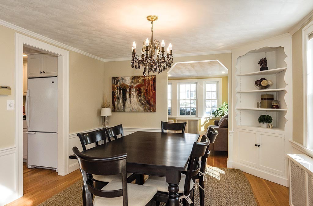 68 Bow Road Newton, MA 02459 - Photo 5 of 16 a dining room with furniture a chandelier and wooden floor