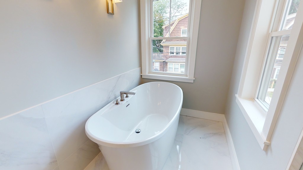 48 St John Street Boston, MA 02130 - Photo 14 of 25 a bathroom with a sink and a bathtub