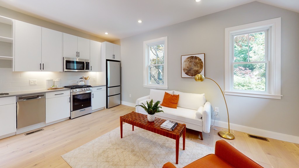 48 St John Street Boston, MA 02130 - Photo 17 of 25 a living room with furniture and a window