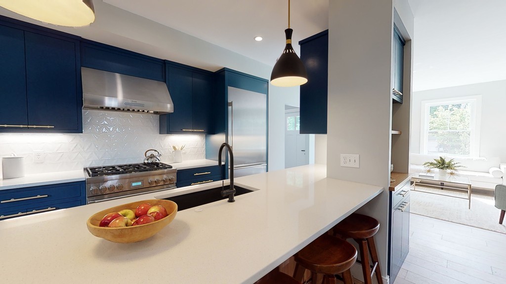 48 St John Street Boston, MA 02130 - Photo 2 of 25 a kitchen with a table and chairs in it