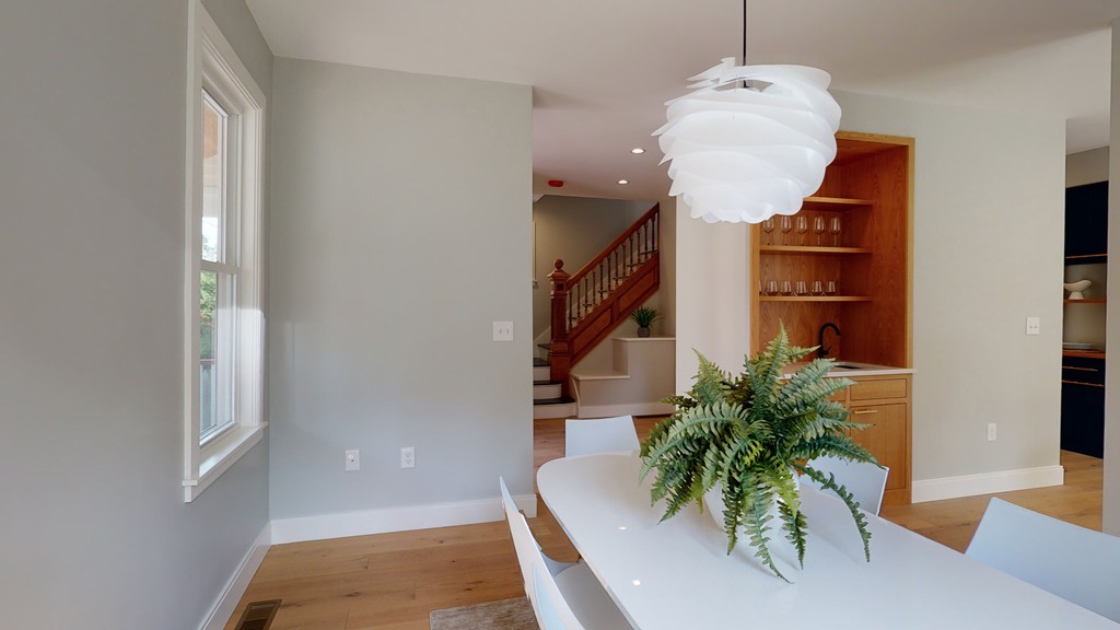 48 St John Street Boston, MA 02130 - Photo 5 of 25 a living room with furniture and a potted plant