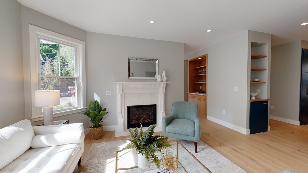 48 St John Street Boston, MA 02130 - Photo 8 of 25 a living room with furniture and a fireplace