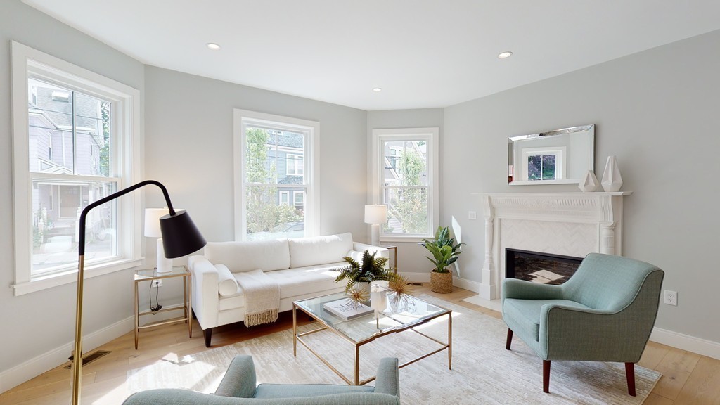 48 St John Street Boston, MA 02130 - Photo 9 of 25 a living room with furniture and a fireplace