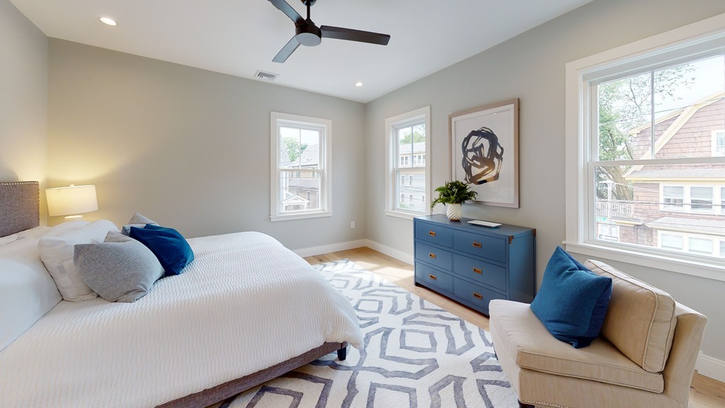 48 St John Street Boston, MA 02130 - Photo 10 of 25 a bedroom with a bed and windows