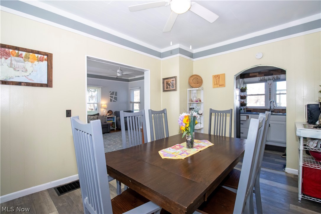 5299 Overton Road Wooster, OH 44691 - Photo 14 of 26 Dining area featuring a wealth of natural light, ornamental molding, dark hardwood / wood-style flooring, and ceiling fan