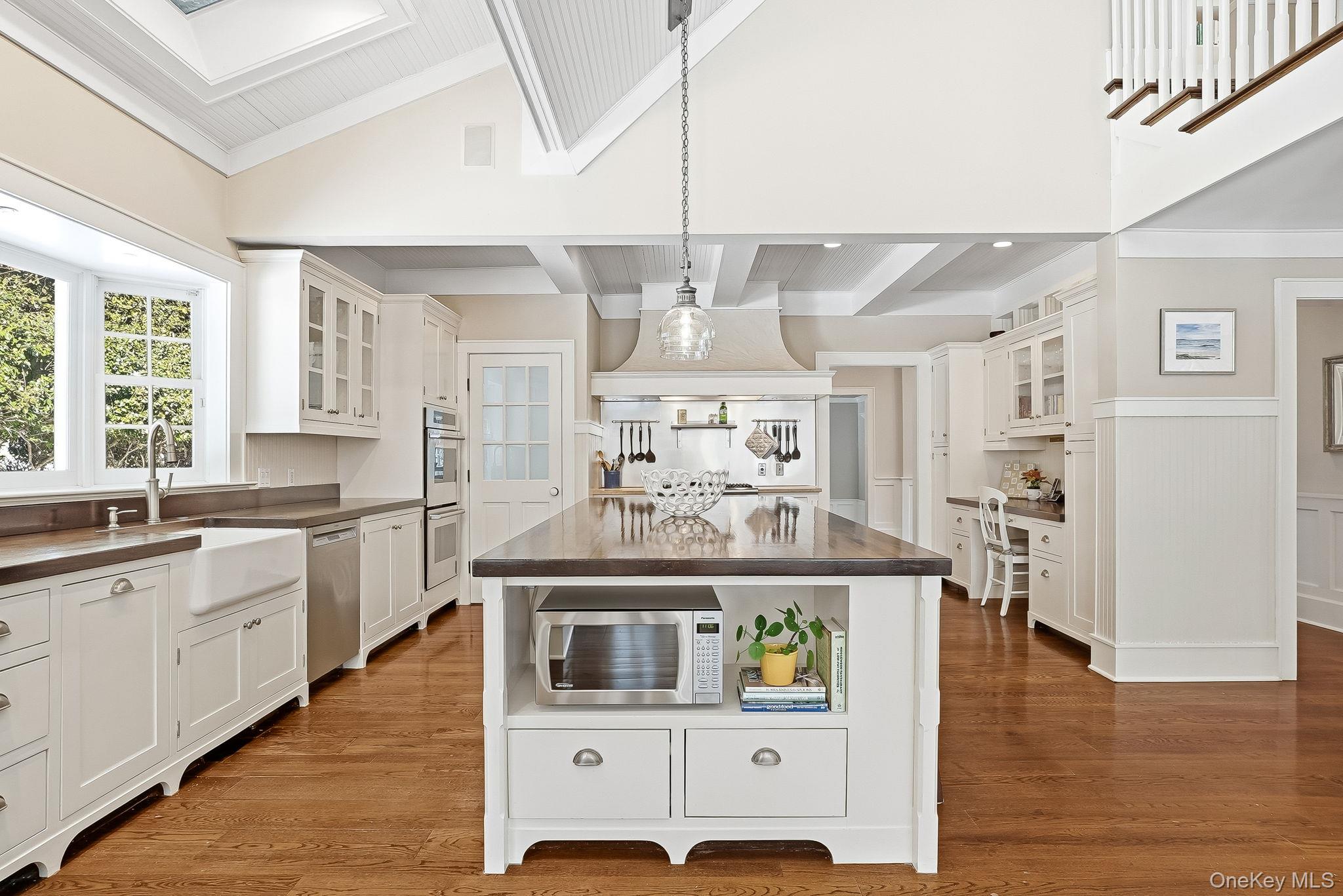 880 Forest Avenue Rye, NY 10580 - Photo 12 of 48 a living room with stainless steel appliances kitchen island granite countertop furniture and a kitchen view